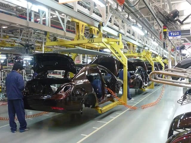 Workers on a Geely assembly line in Beilun, Ningbo, building cars.