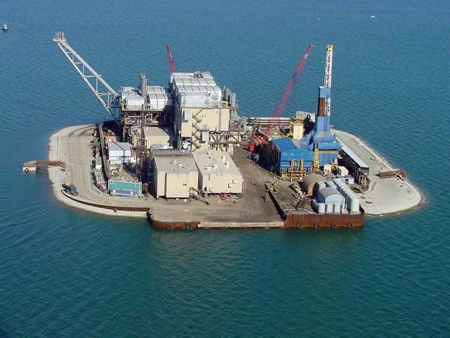 Aerial view of Northstar Offshore Island, an oil and gas drilling platform, in the Beaufort Sea.