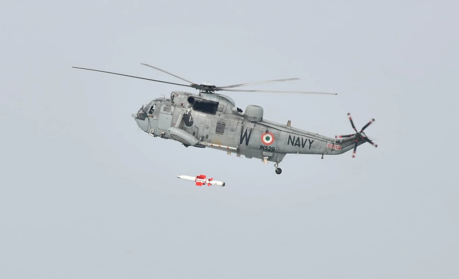 Indian Navy Seaking 42B helicopter launching NASAM-SR anti-ship missile during a test.