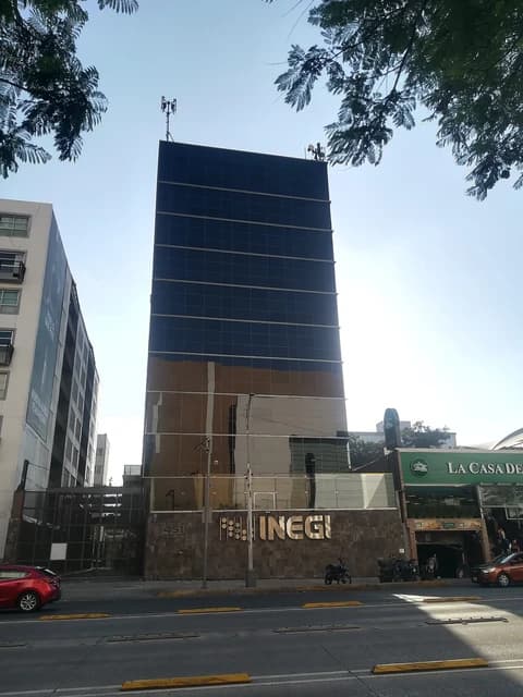 Exterior shot of a multi-story building with a sign that reads INEGI.