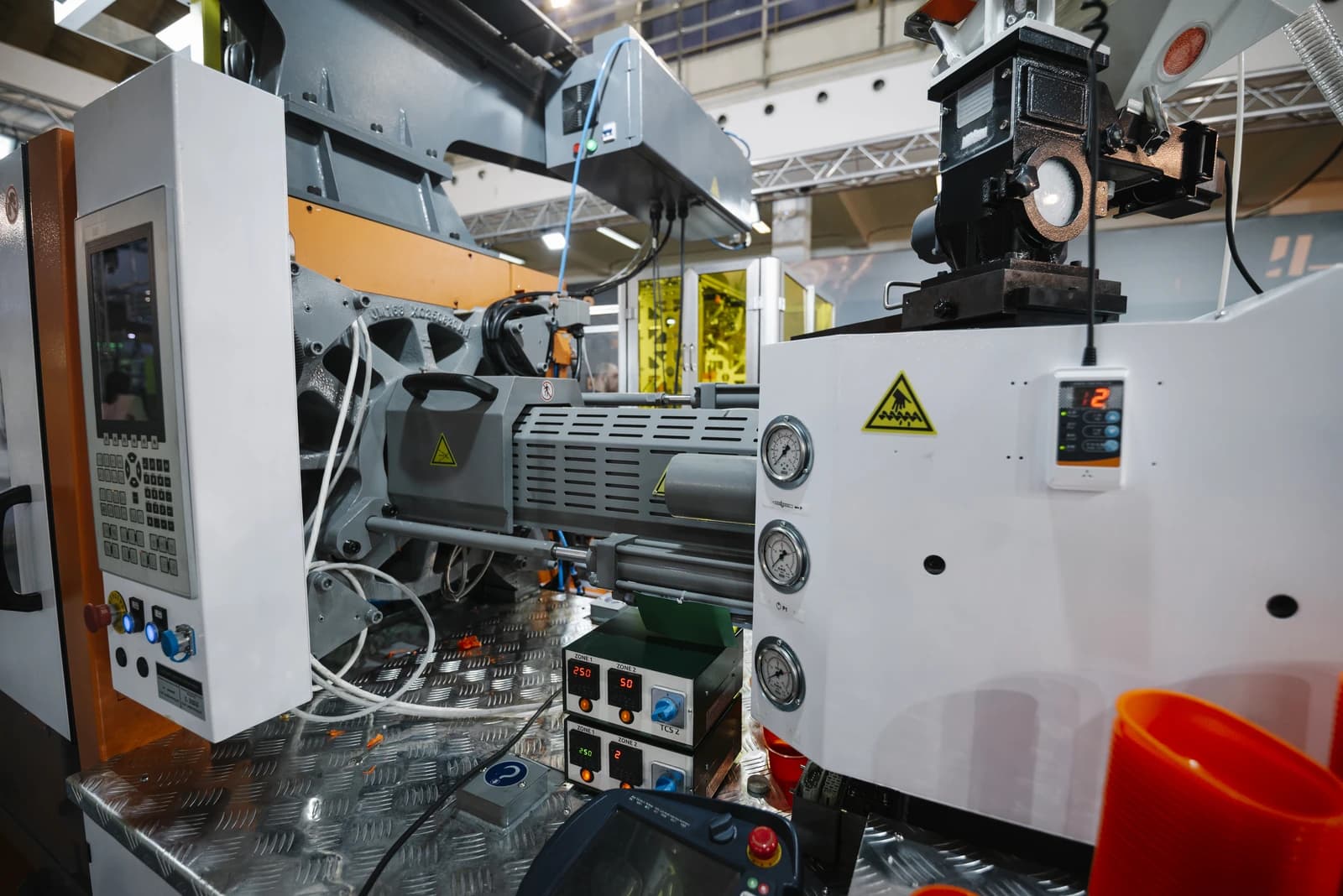 Close-up of industrial machinery and control panels inside a manufacturing facility.