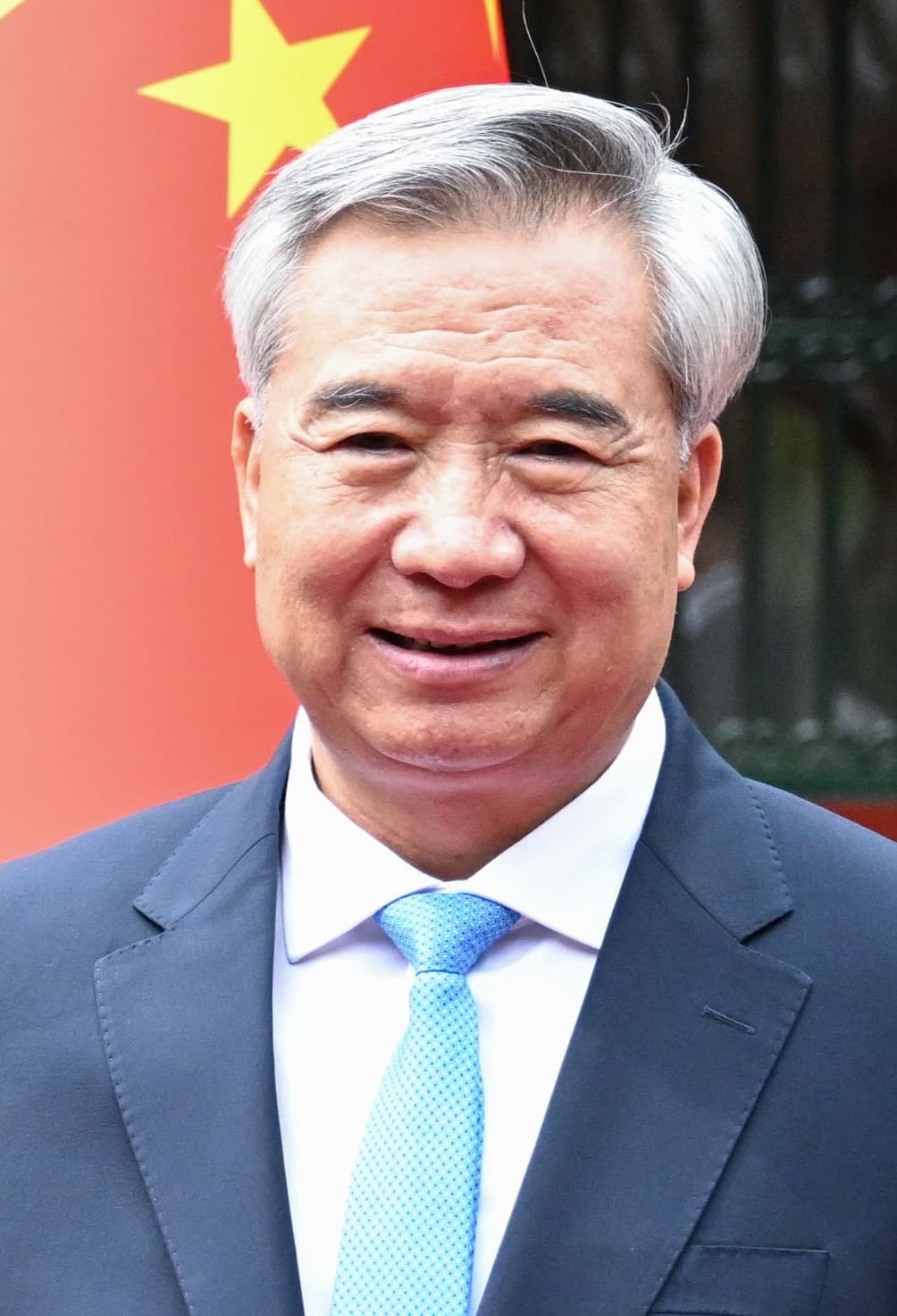 Li Xi, Secretary of the Central Commission for Discipline Inspection, smiling.