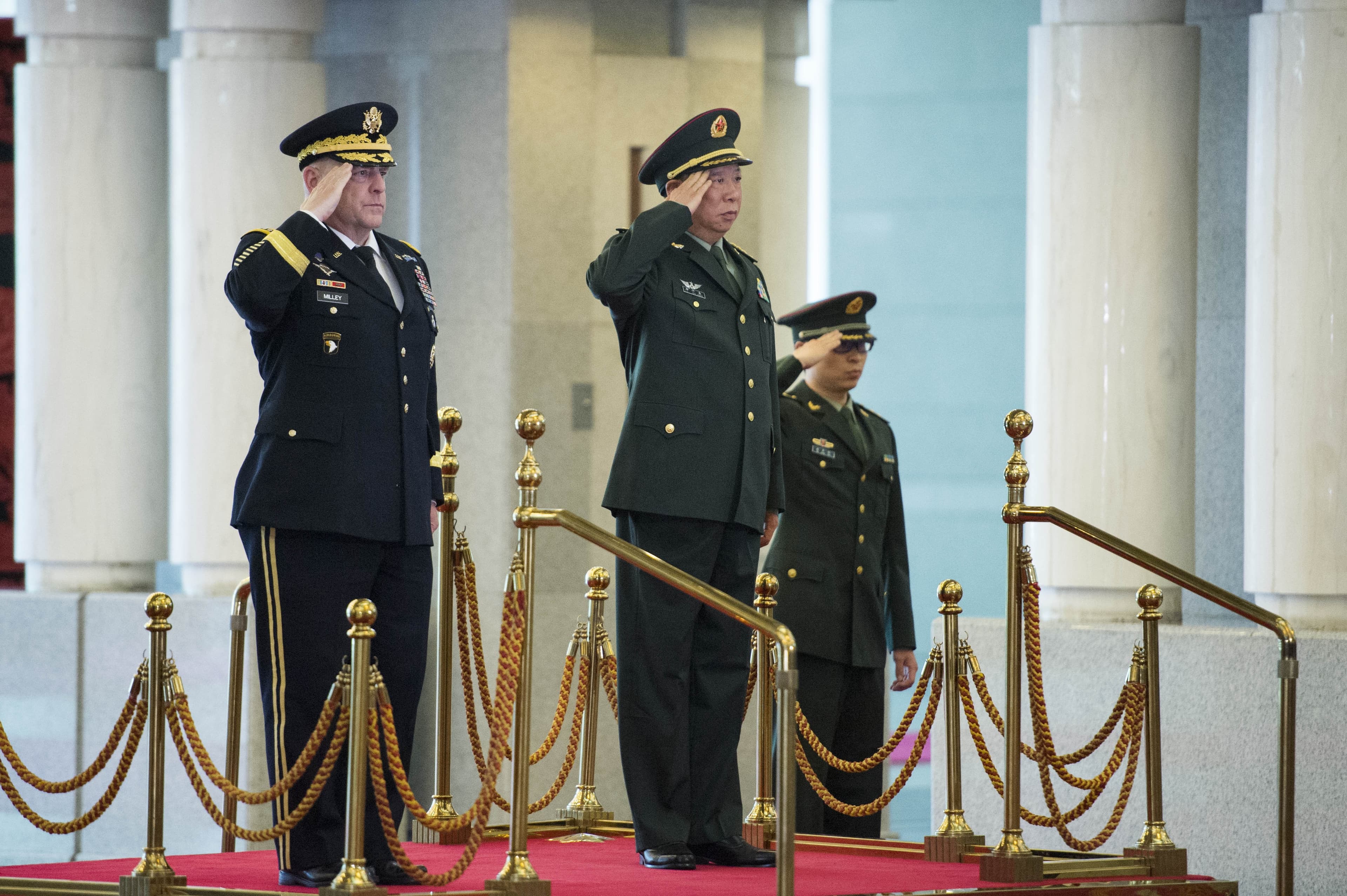 US Army Chief of Staff and Chinese counterpart saluting in Beijing.