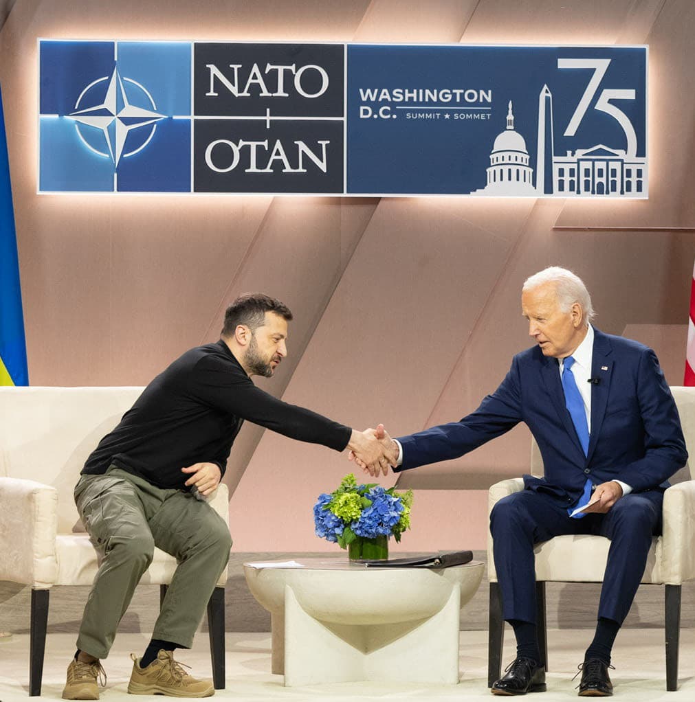 President Joe Biden shakes hands with Ukrainian President Volodymyr Zelenskyy at a NATO Summit.